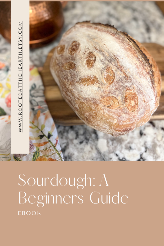 Sourdough: A Beginner’s Guide ebook cover showing a rustic sourdough loaf on a marble counter with a copper pot and floral napkin.